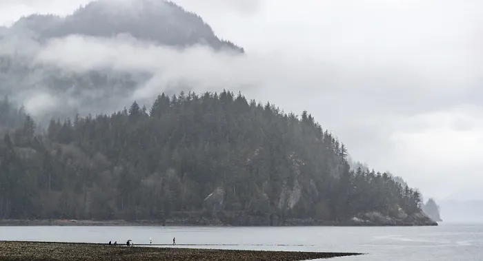 Framed Print : Misty beach scene with fog-covered mountains Framed Print : Misty beach scene with fog-covered mountains