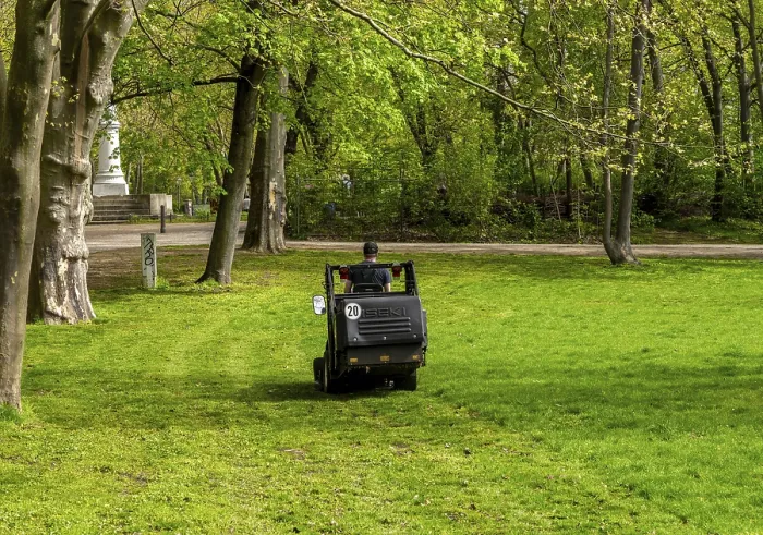Framed Print : Mobile lawn mower, Gaertner im Park Framed Print : Mobile lawn mower, Gaertner im Park