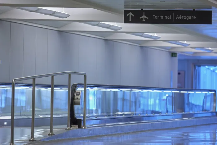 Framed Print : Modern airport terminal with blue illuminated walkway