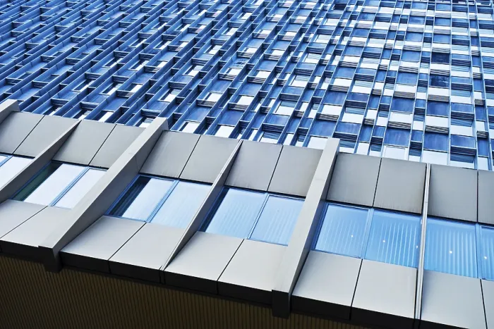 Framed Print : Modern building with a repetitive pattern of windows on a blue facade