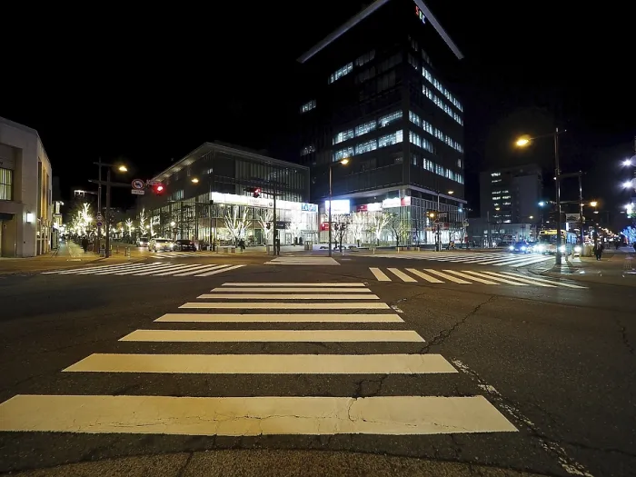 Framed Print : Modern buildings light up a nocturnal intersection full of lights