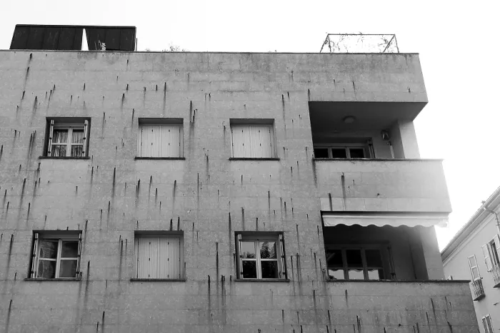 Framed Print : A modern concrete building with multiple windows and balconies Framed Print : A modern concrete building with multiple windows and balconies