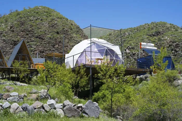 Framed Print : A modern dome tent in a mountainous landscape under blue sky Framed Print : A modern dome tent in a mountainous landscape under blue sky