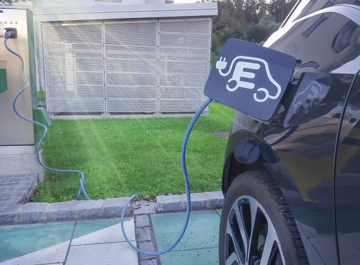Framed Print : Modern electric car plugged
