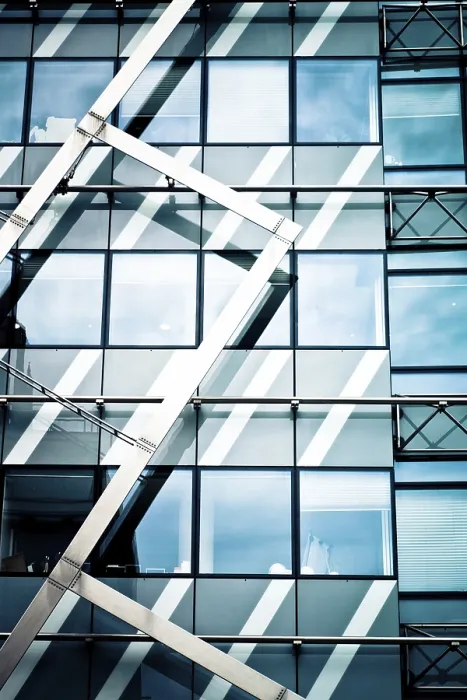 Framed Print : Modern glass building with geometric metal framework and reflections
