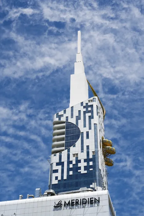Framed Print : Modern high-rise building with distinctive design against a blue sky