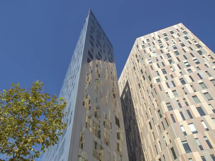 Framed Print : Two modern high-rise buildings with glass facades under a clear blue sky