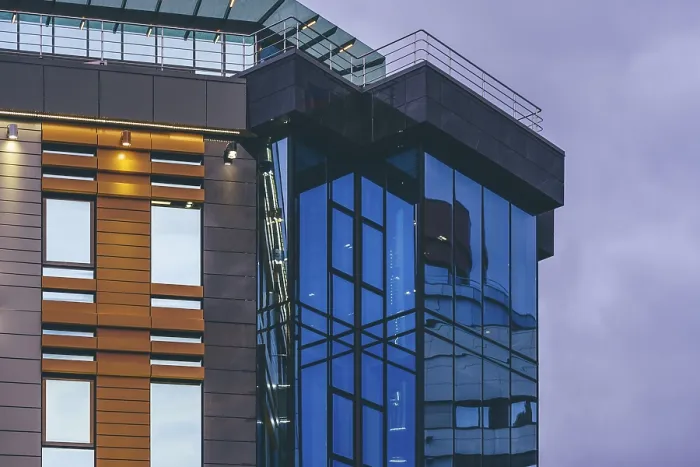 Framed Print : Modern high-rise office building with a glass facade Framed Print : Modern high-rise office building with a glass facade