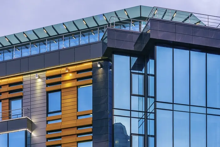 Framed Print : Modern high-rise office building with a glass facade at overcast