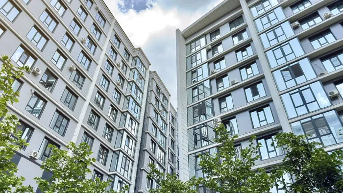 Framed Print : Modern high-rise residential buildings with reflective glass windows and air conditioners