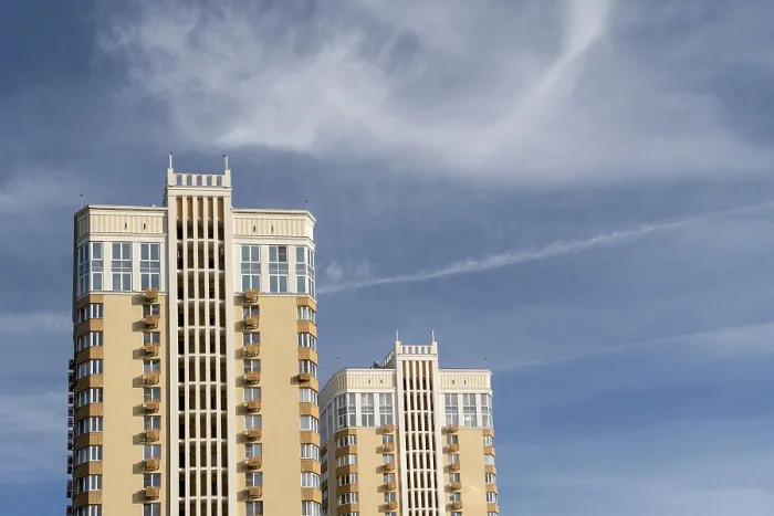Framed Print : Two modern multi-storey buildings rise against the sky