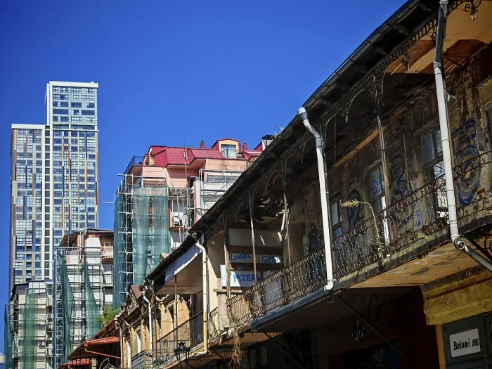 Framed Print : Modern and old architecture contrasting under clear skies
