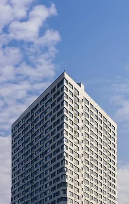 Framed Print : Modern Skyscraper on the Cloudy Sky Background