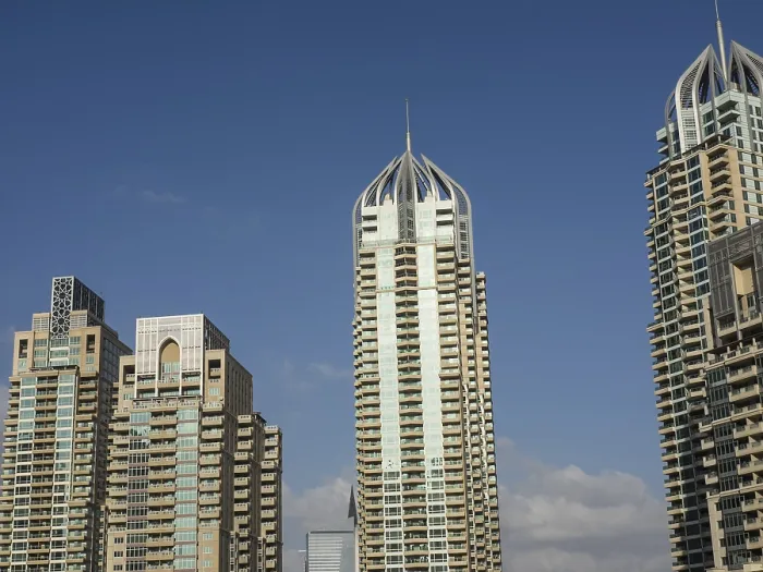 Framed Print : Three modern skyscrapers with architectural details rise into the sky