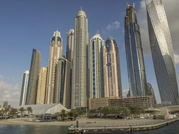 Framed Print : Modern skyscrapers on harbor with blue sky and water