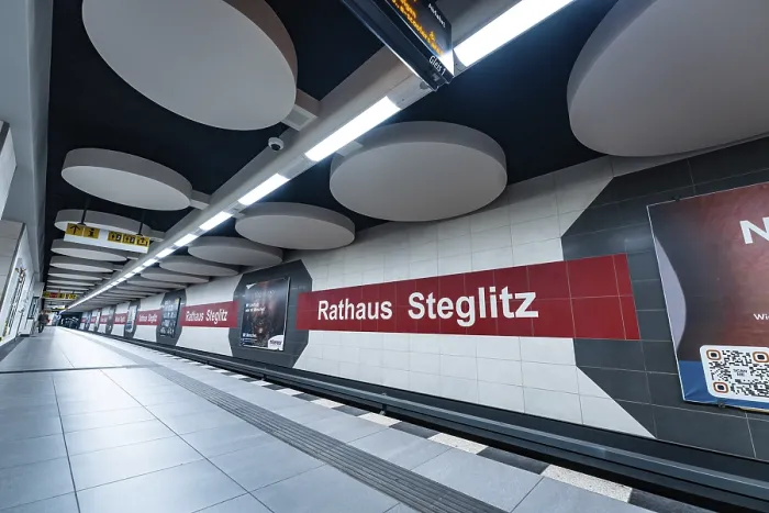 Framed Print : Modern underground station with advertising on pillars and platform in clear lines