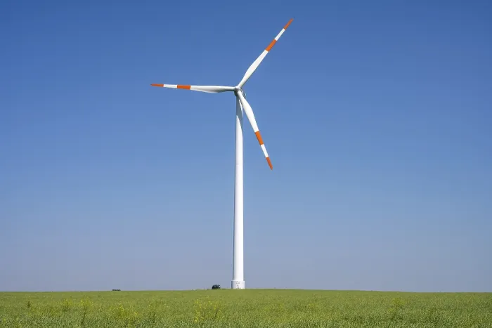 Framed Print : Modern wind turbine against a blue sky in Germany