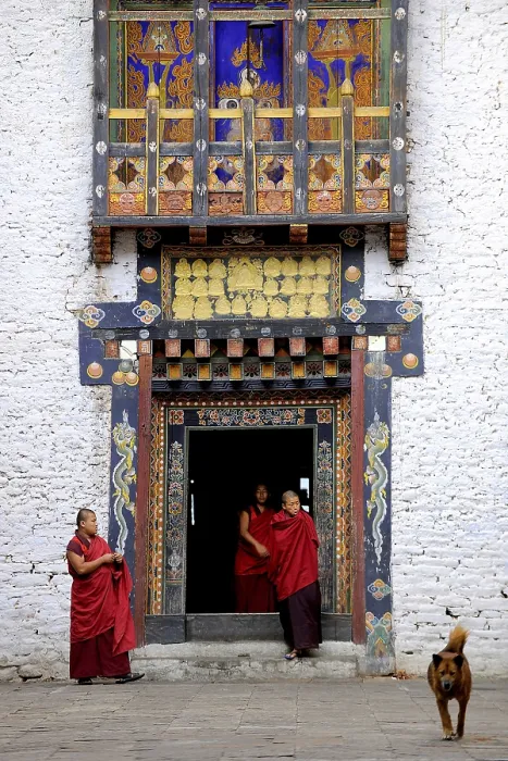 Framed Print : Monks of the Drukpa monastic community entering the courtyard of Trashigang Dzong fortress