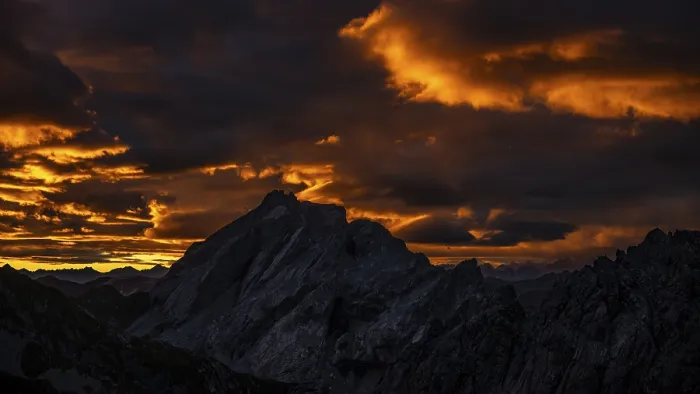 Framed Print : Montafon mountains with dramatic cloudy sky at sunrise