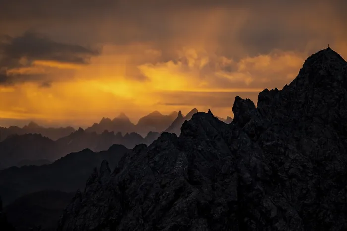 Framed Print : Montafon mountains with dramatic cloudy sky at sunrise