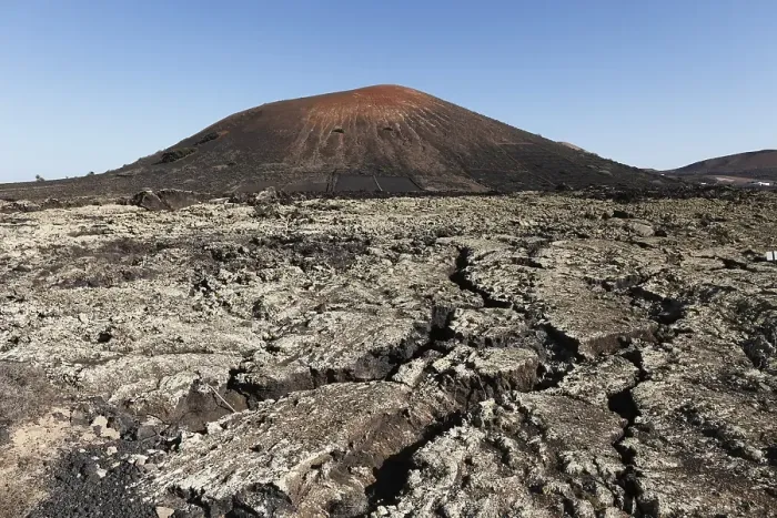 Framed Print : Montana Negra volcano, lava field