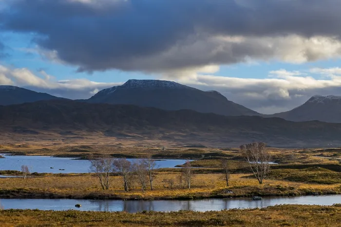 Framed Print : Moor landscape with cloudy sky and mountains in the background