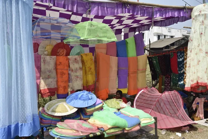 Framed Print : Mosquito umbrella vendor, Holi Festival Framed Print : Mosquito umbrella vendor, Holi Festival