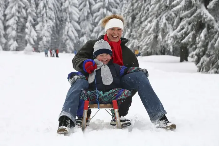 Framed Print : Mother and boy, four years, sledging