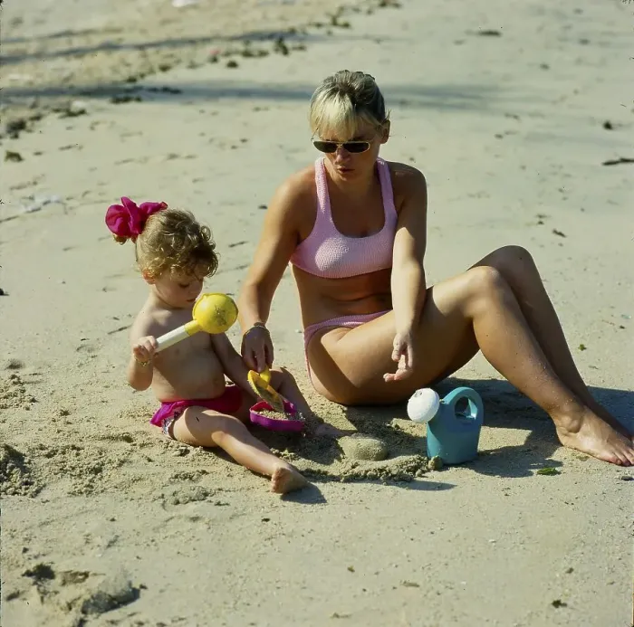 Framed Print : Mother and daughter 2 years on the sandy beach