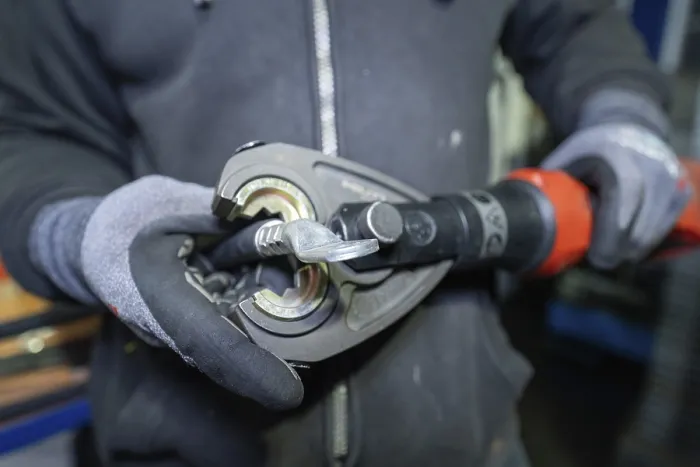Framed Print : Mould presses a cable in a technical environment