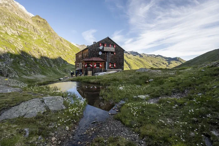 Framed Print : Mountain hut Elberfelderhutte with small lake and cotton grass