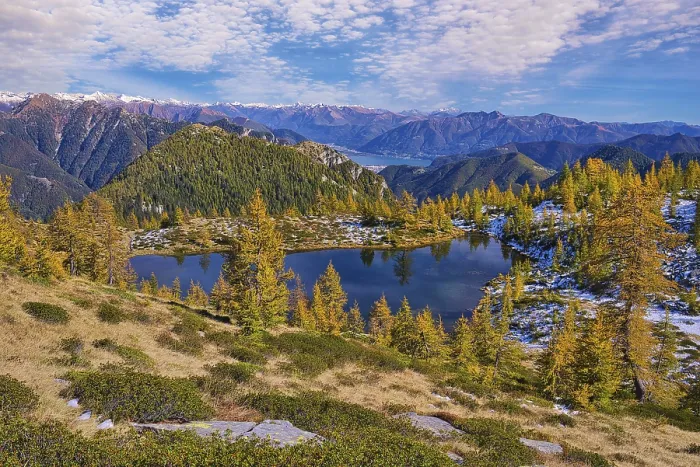 Framed Print : Mountain lake surrounded by autumnal larches Framed Print : Mountain lake surrounded by autumnal larches