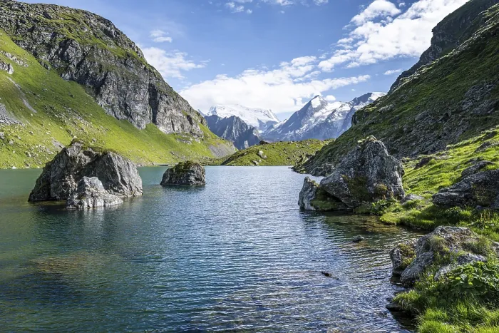 Framed Print : Mountain lake with view of glaciated mountain peaks Framed Print : Mountain lake with view of glaciated mountain peaks