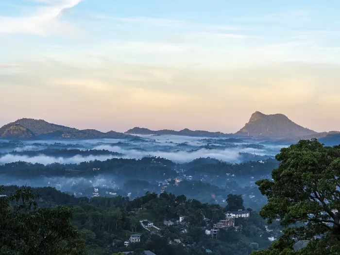 Framed Print : Mountain landscape with morning mist over forests near Kandy