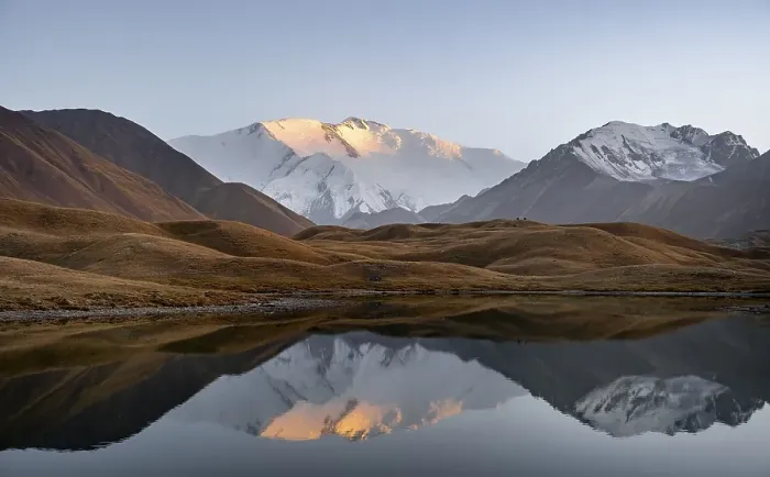 Framed Print : Mountain landscape at sunset, mountains reflected in a small mountain lake Framed Print : Mountain landscape at sunset, mountains reflected in a small mountain lake