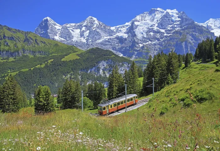 Framed Print : Mountain meadow and Muerren railway with the triumvirate of the Eiger