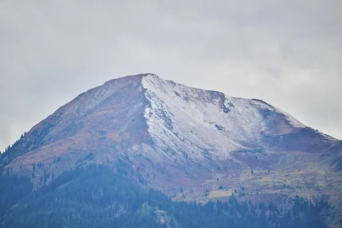 Framed Print : Mountain peak covered with snow in fall