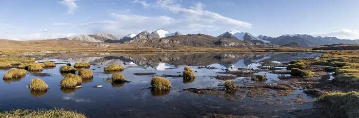 Framed Print : Mountain peaks reflected in a mountain lake