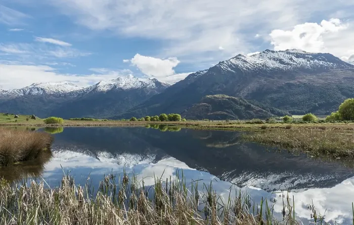 Framed Print : Mountain range reflected in a lake