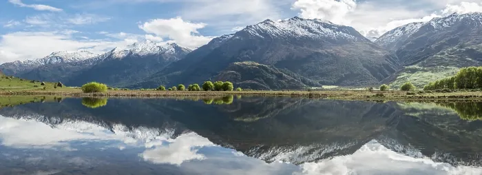 Framed Print : Mountain range reflected in a lake