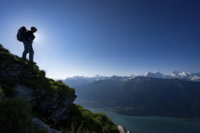 Framed Print : Mountain ridge with mountaineers and Swiss mountains and Lake Thun in the background at sunrise Framed Print : Mountain ridge with mountaineers and Swiss mountains and Lake Thun in the background at sunrise