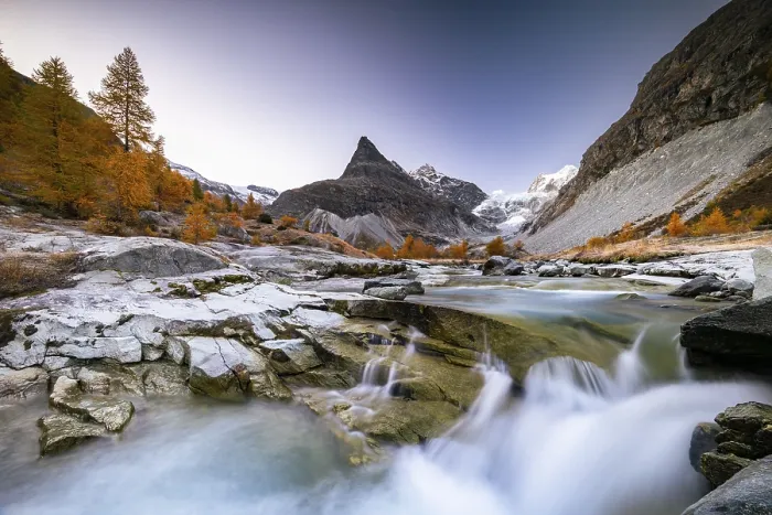 Framed Print : Mountain stream with autumnal larches and mountain views Framed Print : Mountain stream with autumnal larches and mountain views