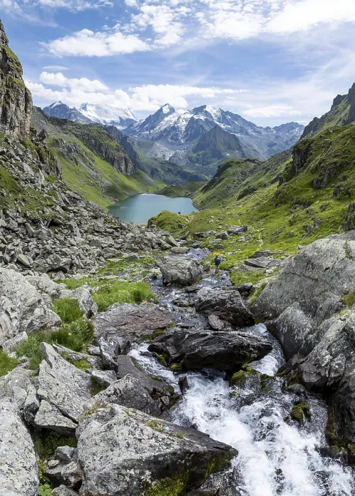 Framed Print : Mountain stream and mountain lake Lac de Louvie with glaciated summit of the Grand Combin