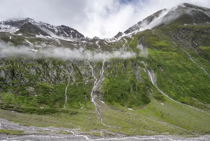 Framed Print : Mountain streams flow over steep mountain slopes into the tagl of the Schlegeisgrund