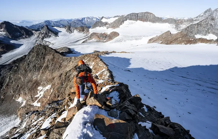 Framed Print : Mountaineer climbing on a rocky ridge on the mountain peak Wilder Freiger