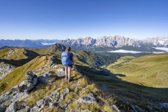 Framed Print : Mountaineer on a grassy ridge, mountain panorama Framed Print : Mountaineer on a grassy ridge, mountain panorama