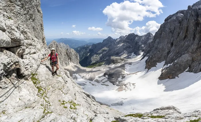 Framed Print : Mountaineer with helmet in a secured via ferrata