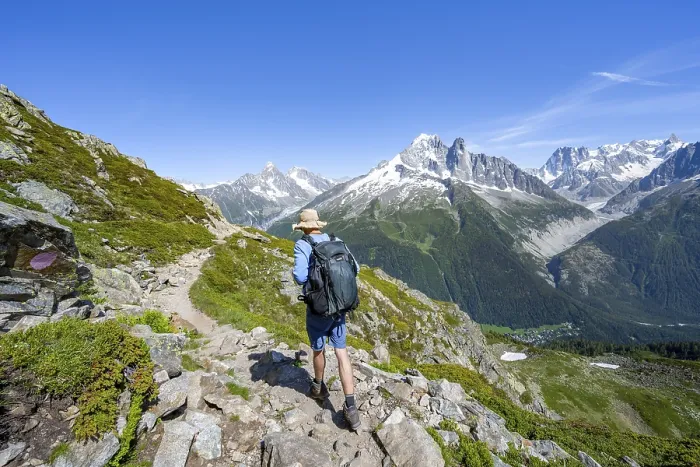 Framed Print : Mountaineer on a hiking trail in front of a mountain landscape Framed Print : Mountaineer on a hiking trail in front of a mountain landscape