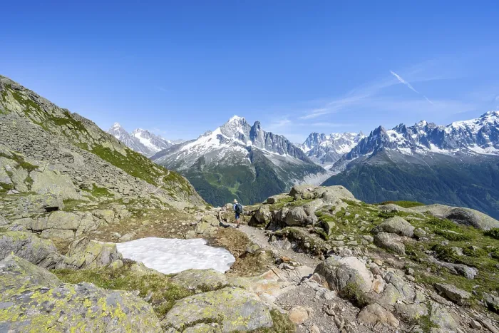 Framed Print : Mountaineer on a hiking trail in front of a mountain landscape Framed Print : Mountaineer on a hiking trail in front of a mountain landscape