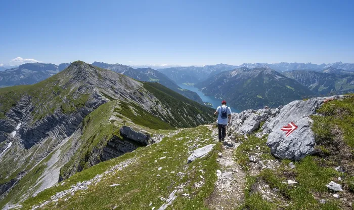 Framed Print : Mountaineer on the hiking trail on the summit ridge of the Unnuetz Framed Print : Mountaineer on the hiking trail on the summit ridge of the Unnuetz